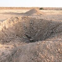 A crater is seen near a taxiway at the Nevatim Airbase, following an Iranian ballistic missile strike, April 14, 2024. (Israel Defense Forces)