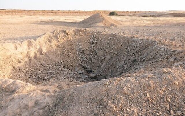 A crater is seen near a taxiway at the Nevatim Airbase, following an Iranian ballistic missile strike, April 14, 2024. (Israel Defense Forces)