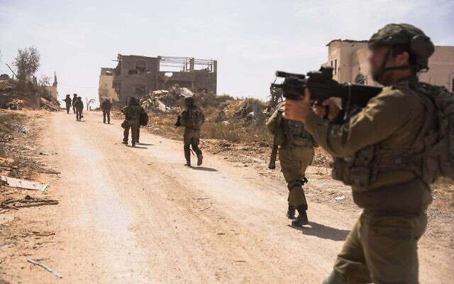 IDF troops operate in the central Gaza corridor, in a handout image published April 28, 2024. (Israel Defense Forces)