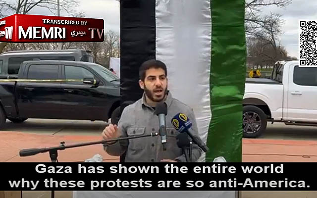 Anti-Israel activist Tarek Bazzi speaks in front of a Palestinian flag at an al-Quds Day rally in Dearborn, Michigan, April 5, 2024. (MEMRI screenshot: used in accordance with Clause 27a of the Copyright Law)