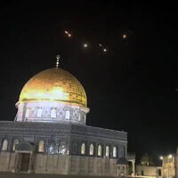 The Dome of the Rock atop the Temple Mount in Jerusalem's Old City, with the lights of missile interceptions visible in the night sky, early on April 14, 2024, after Iran fired ballistic missiles at Israel. (Social media/X; used in accordance with Clause 27a of the Copyright Law)
