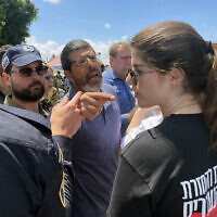 A supporter of National Security Minister Itamar Ben Gvir yells at a protester outside the Ashdod military cemetery following a Memorial Day ceremony on May 13, 2024. (Sam Sokol/Times of Israel)