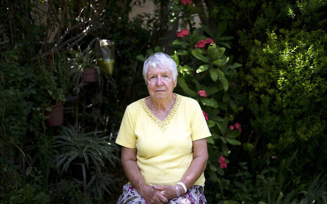 Judith Tzamir, a Holocaust survivor from Germany, poses for a portrait in her family home in Kibbutz Mefalsim, southern Israel, May 3, 2024. (AP Photo/Maya Alleruzzo)