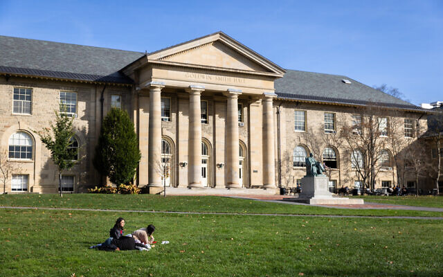 Cornell University students sit outside on November 3, 2023 in Ithaca, New York.   (Matt Burkhartt/Getty Images/AFP)