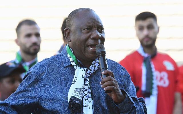 South African President Cyril Ramaphosa, wearing a keffiyah scarf, speaks before an exhibition football match between Western Cape XI and the Palestinian national football team at Athlone Stadium in Athlone, near Cape Town, on February 11, 2024. (Rodger Bosch/AFP)