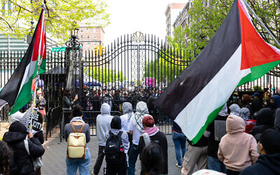 Student pro-Palestinian protesters chant near an entrance to Columbia University on April 30, 2024, in New York City (Michael M. Santiago / Getty Images via AFP)