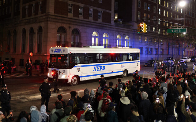 A NYPD bus carries arrested students at Columbia University in New York City on April 30, 2024 (CHARLY TRIBALLEAU / AFP)