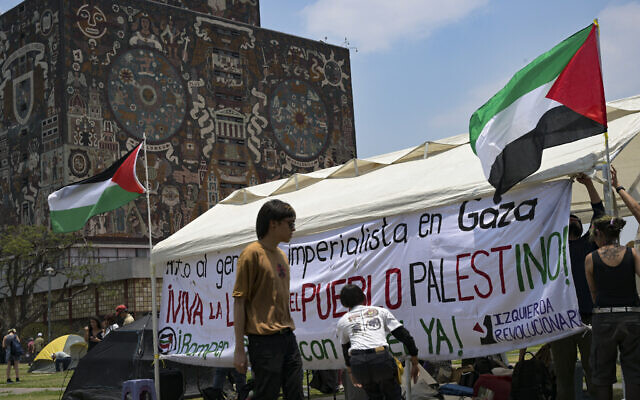 Activists from the Interuniversity and Popular Assembly in Solidarity with the People of Palestine erect a tent in front of the rectory building of the Autonomous University of Mexico (UNAM) as part of a camp to protest Israel, in Mexico City on May 2, 2024. (Yuri Cortez/AFP)