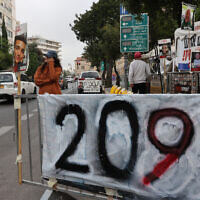 Relatives of Gaza hostages set up large banners and placards calling for their release during a protest in front of the Prime Minister's Residence in Jerusalem on May 2, 2024. (Gil Cohen-Magen / AFP)