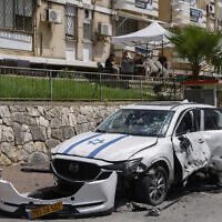 A damaged car during rocket fire from south Lebanon toward Kiryat Shmona near the Lebanese border on May 5, 2024. (Jalaa MAREY / AFP)
