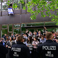 Anti-Israel activists face police forces at the university campus of the Free University of Berlin, Germany, on May 7, 2024. (Tobias Schwarz/AFP)