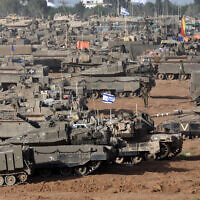 Illustrative: IDF tanks are positioned in southern Israel near the border with the Gaza Strip on May 9, 2024. (Ahmad Gharabli/AFP)