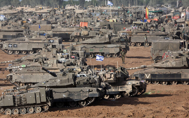 Illustrative: IDF tanks are positioned in southern Israel near the border with the Gaza Strip on May 9, 2024. (Ahmad Gharabli/AFP)