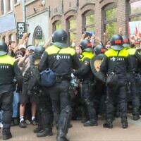 Dutch police clash with anti-Israel protesters at the University of Amsterdam on May 13. (AFP)