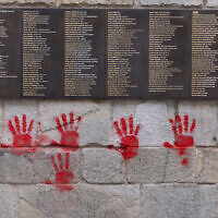 Red hands graffitis are seen on the "Wall of the Righteous" (Mur des Justes), in Paris, France, on May 14, 2024. (Antonin UTZ / AFP)