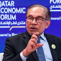 Malaysia's Prime Minister Anwar Ibrahim speaks at the Qatar Economic Forum in Doha on May 14, 2024. (Karim JAAFAR / AFP)