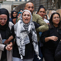 Mourners and relatives cry during the funeral of Palestinian Ayser Mohammad Safi, in Ramallah in the West Bank on May 15, 2024. (JAAFAR ASHTIYEH / AFP)