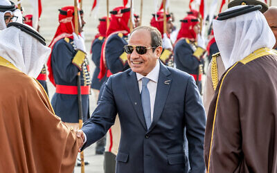 This handout picture from the official Bahrain News Agency (BNA) shows Egypt's President Abdel Fattah al-Sisi (C) being received in Manama on May 15, 2024 ahead of the 33rd Arab League Summit. (BNA (Bahrain News Agency) / AFP)