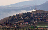 A picture taken from southern Lebanon shows smoke rising above the northern Israeli town of Metula following a strike from the Lebanese side on May 16, 2024. (Rabih Daher / AFP)
