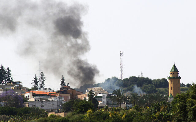 Smoke billows during purported Israeli bombing over the Lebanese village of Najjariyeh on May 17, 2024. (Mahmoud Zayyat/AFP)
