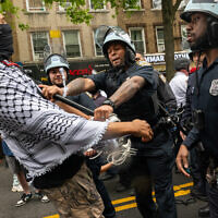 Pro-Palestinian, anti-Israel protesters confront police during a Nakba Day rally and march on May 18, 2024 in the Bay Ridge section of Brooklyn, New York. (Spencer Platt/ Getty Images/ AFP)