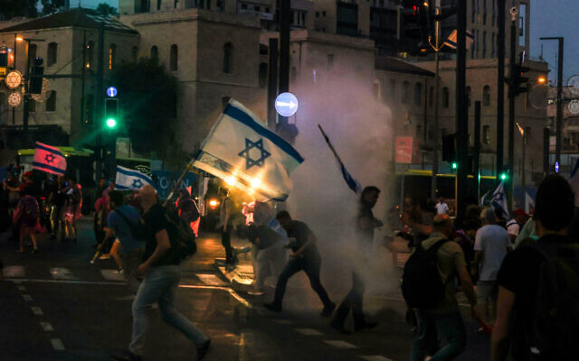 Israeli police spray Skunk chemical compound on demonstrators to disperse a protest against Prime Minister Benjamin Netanyahu's government in Jerusalem, on May 20, 2024. (Menahem Kahana/AFP)