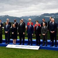 Finance ministers and central bank governors pose for the family picture at the G7 Finance Ministers meeting in Stresa, Italy, on May 24, 2024. (Gabriel Bouys/AFP)
