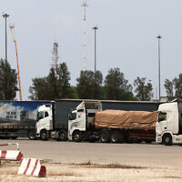 Trucks carrying humanitarian aid are pictured at the Israeli side of the Kerem Shalom border crossing with the Gaza Strip in southern Israel on May 28, 2024, amid the ongoing conflict in the Palestinian territory between Israel and Hamas. (Menahem KAHANA / AFP)