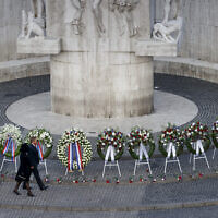 King Willem-Alexander and Queen Maxima walked past wreaths at the national monument during the Remembrance Day ceremony on Dam Square in Amsterdam, Netherlands, May 4, 2022, commemorating civilians and members of the armed forces who have died in wars and peacekeeping missions since the start of the Second World War. (Koen van Weel/Pool Photo via AP)