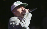 Macklemore performs during the South by Southwest Music Festival on March 17, 2023, in Austin, Texas. (Photo by Jack Plunkett/Invision/AP)