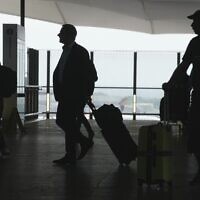 Passengers walk at Heathrow Airport, in London Saturday, May 27, 2023. (AP/Kin Cheung)
