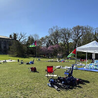 Tents, flags and other supplies remain at Deering Meadow on Northwestern University's campus in Evanston, Ill. on Tuesday, April 30, 2024, a day after the university and protest organizers announced an agreement which largely ended anti-war demonstrations that have lasted days. (AP Photo/Melissa Perez Winder)