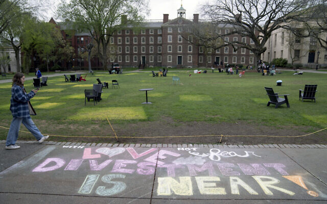 A message in chalk decorates a sidewalk after a pro-Palestinian, anti-Israel  encampment was taken down at Brown University, Tuesday, April 30, 2024, in Providence, Rhode Island. (AP Photo/David Goldman)