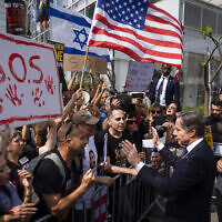 US Secretary of State Antony Blinken speaks to families and supporters of Israeli hostages held by Hamas in Gaza during a protest calling for their return, after meeting families of hostages in Tel Aviv, Israel, Wednesday, May 1, 2024. (AP Photo/Oded Balilty)