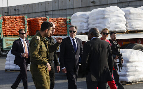 US Secretary of State Antony Blinken, center, walks with Defense Minister Yoav Gallant, center left, and UN Senior Humanitarian and Reconstruction Coordinator for Gaza, Sigrid Kaag, 2nd right, at the Kerem Shalom border crossing in Kerem Shalom, Israel, Wednesday May 1, 2024. (Evelyn Hockstein/Pool Photo via AP)
