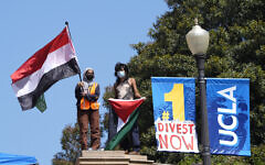 Demonstrators wave Yemen and Palestinian flags on the UCLA campus, after nighttime clashes between Pro-Israel and Pro-Palestinian groups, Wednesday, May 1, 2024, in Los Angeles. (AP Photo/Jae C. Hong)