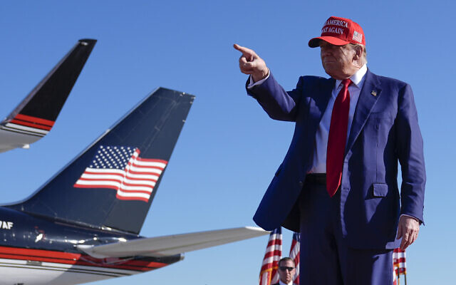 Presumed Republican presidential candidate former US president Donald Trump gestures at a campaign rally in Freeland, Michigan, May 1, 2024. (Paul Sancya/AP)