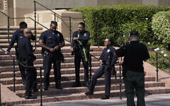 Officers stage near the site of a pro-Palestinian, anti-Israel encampment, cleared by police overnight, on the UCLA campus Thursday, May 2, 2024, in Los Angeles. (AP Photo/Mark J. Terrill)