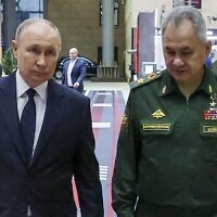 Russian President Vladimir Putin, left, and Russian Defense Minister Sergei Shoigu arrive for a meeting with the military brass in Moscow, Russia, December 19, 2023. (Mikhail Klimentyev, Sputnik, Kremlin Pool Photo via AP, File)