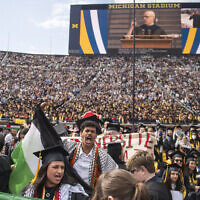 Students chant in support of Palestinians during the University of Michigan's Spring 2024 Commencement Ceremony at Michigan Stadium in Ann Arbor, Michgian, May 4, 2024. (Katy Kildee/Detroit News via AP)