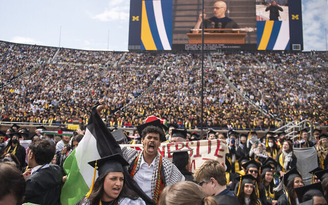 Students chant in support of Palestinians during the University of Michigan's spring 2024 Commencement Ceremony at Michigan Stadium in Ann Arbor, Michigan, May 4, 2024. (Katy Kildee/Detroit News via AP)