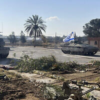 A tank with an Israeli flag on it enters the Gazan side of the Rafah Border Crossing on May 7, 2024. (Israel Defense Forces via AP)