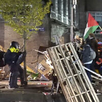 In this image taken from video police arrest activists as they broke up a pro-Palestinian, anti-Israel demonstration camp at the University of Amsterdam in Amsterdam, the Netherlands, May 7, 2024. (AP Photo)