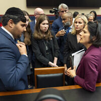Kobie Talmoud, 16, left, a student at John F. Kennedy High School in Silver Spring, Maryland, speaks with Karla Silvestre, President of the Montgomery Count Board of Education, after a hearing on antisemitism in K-12 public schools, by the Subcommittee on Early Childhood, Elementary, and Secondary Education, May 8, 2024, on Capitol Hill in Washington. (AP Photo/Jacquelyn Martin)