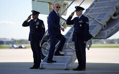 US President Joe Biden boards Air Force One as he departs Milwaukee Mitchell International Airport, Wednesday, May 8, 2024, in Milwaukee. (AP Photo/Evan Vucci)