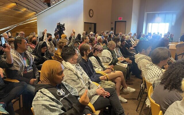Pro-Palestinian, anti-Israel supporters attended a University of Minnesota's Board of Regents meeting on Friday, May 10, 2024, in Minneapolis to demand divestment from companies that profit off the Israel-Hamas war. (AP Photo/Trisha Ahmed)