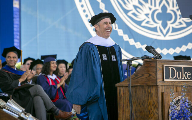 Commencement speaker Jerry Seinfeld laughs on stage during Duke University's graduation ceremony, May 12, 2024, in Durham, North Carolina. (Bill Snead/Duke University via AP)