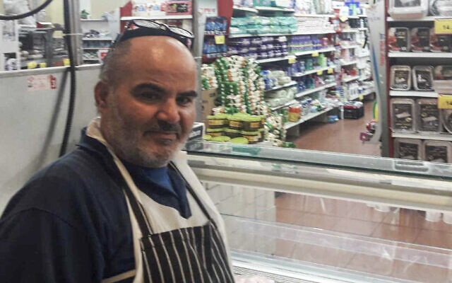 This 2021 photo provided by Haim Parag shows David Ben-Avraham at a supermarket in the Israeli town of Beit Shemesh, where he briefly worked. (Courtesy of Haim Parag via AP)