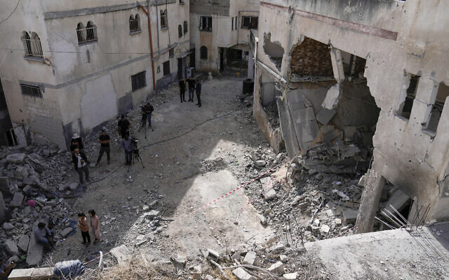 Palestinians look at the damage following an Israeli airstrike in the West Bank Jenin refugee camp, May 18, 2024.  (AP Photo/Majdi Mohammed)