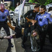 A protester is taken into custody at S. 34th St. near the University of Pennsylvania campus in Philadelphia on May 17, 2024. (Steven M. Falk/The Philadelphia Inquirer via AP)